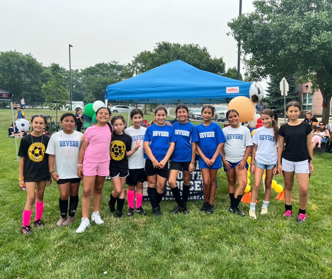 Revere Youth Soccer team celebrating on the field